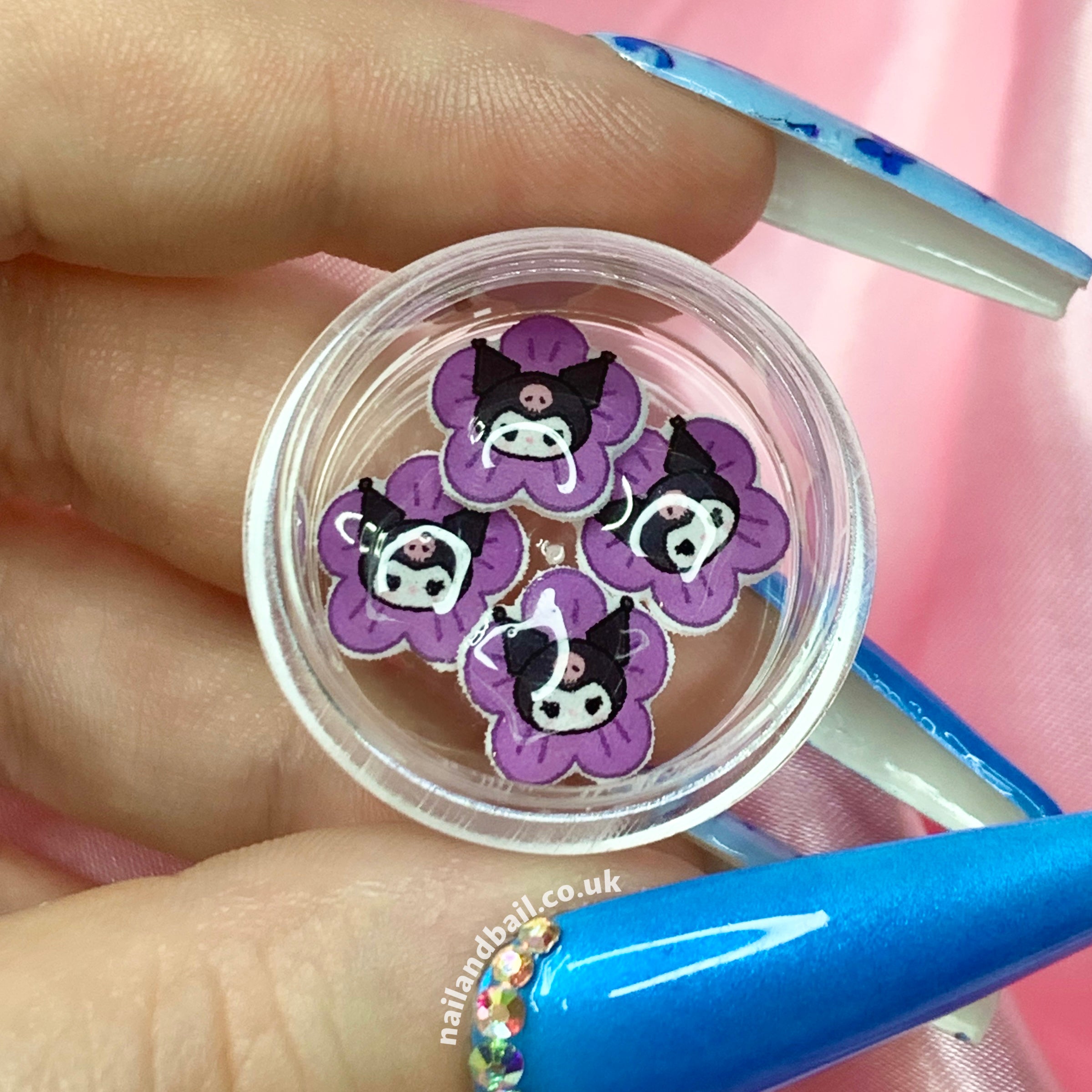 Introducing our 6pcs Handmade Kuromi Flower Nail Charms – a charming addition to your nail art! 🌸🖤Featuring purple flowers with Kuromi's head in the center, these charms effortlessly add a playful touch to your manicure. Order now and let your nails become a canvas of charm and creativity!